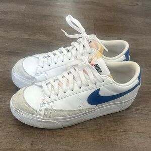 Nike White Low-Top Sneakers with Blue Swoosh